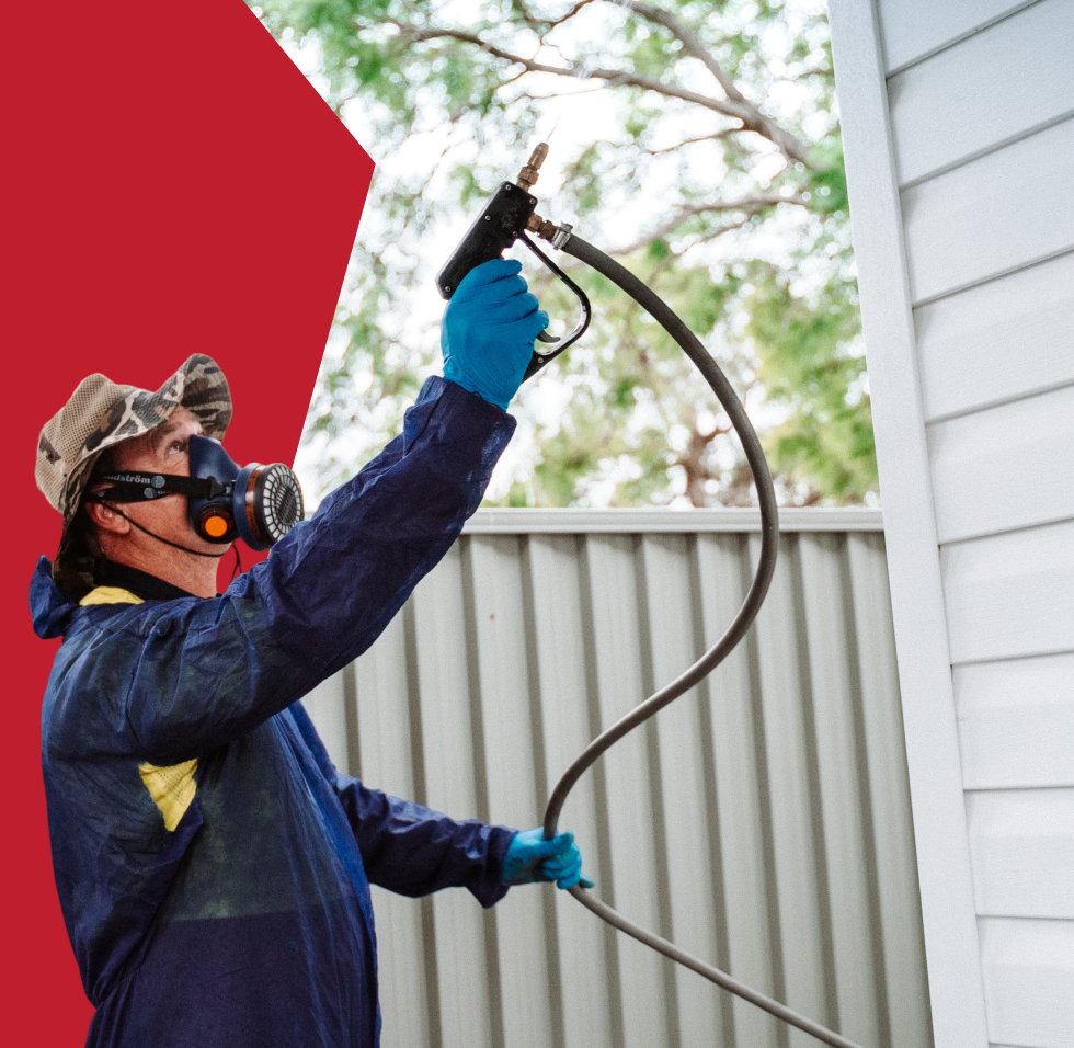 BugFree technician treating a property exterior